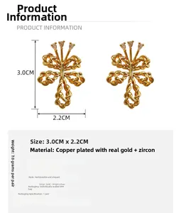Detailed view of bow knot earrings with size 3.0cm by 2.2cm in gold plated copper