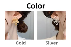 Detailed comparison of gold and silver twisted flower earrings with zircon on model