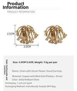 Detail view of gold firework fringe earrings showing 3.0cm by 2.5cm size and 7.5g weight