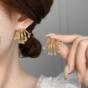 Golden firework tassel earrings with sparkling zircon crystals for a luxury look
