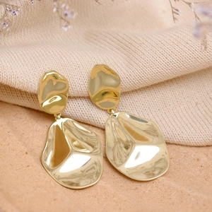 Golden teardrop earrings with irregular lava texture and polished metallic mirror finish