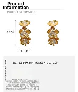 Detail view of gold petal earrings with cubic zirconia and 3.3cm size dimensions