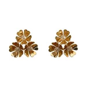 Vintage golden C-shaped floral earrings with three-flower cluster and crystals on white background