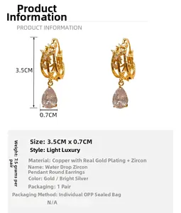 Detailed view of teardrop zircon earrings with dimensions 3.5CM by 0.7CM in gold finish