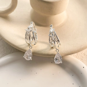 Silver bamboo drop earrings with hollow butterfly design and pear-shaped zircon stones