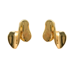 Minimalist irregular twisted gold earrings with a modern liquid lava aesthetic