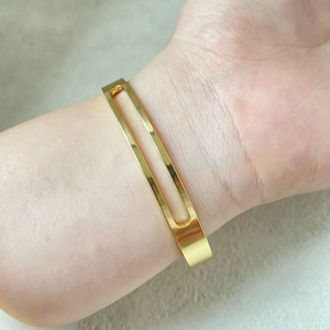 Minimalist gold hollow geometric C-shaped open cuff bracelet for women in mirror finish