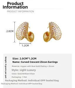 Detailed view of gold plated crescent moon earrings with cubic zirconia and dimensions