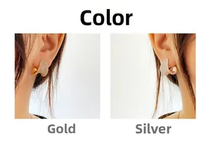 Detailed comparison of gold and silver C-shaped earrings with pave-set shimmering crystals