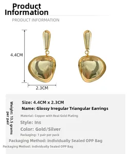 Detail view of gold-plated tassel earrings showing 4.4cm height and 2.3cm width specs
