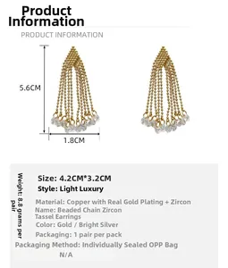 Detailed view of gold-plated tassel earrings with zircon chains and size dimensions