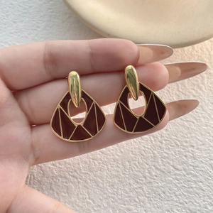Vintage gold-plated asymmetric fan earrings with deep red enamel and geometric inlay