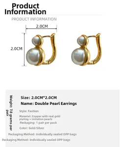 Detail view of French vintage pearl gold plated earrings with 2.0cm size specifications