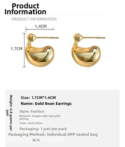 Detailed view of teardrop metal stud earrings with gold finish and product specifications
