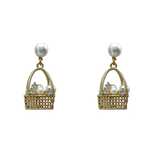 Exquisite gold basket earrings featuring elegant white pearls and sparkling crystals