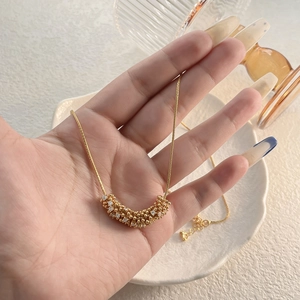 Elegant gold-plated crescent necklace with micro-paved zircons and a classic box chain
