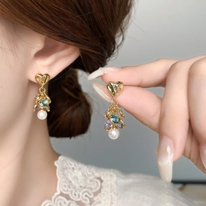 Elegant gold heart earrings with colorful gemstones and white pearl drops for women