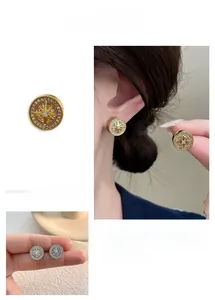 Detailed view of luxury round starburst earrings with sparkling zircon stones in gold