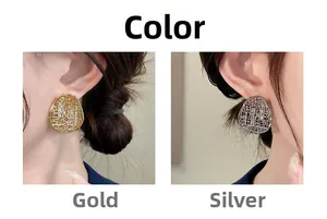 Detail view of 18k gold and silver hollow mesh oval stud earrings on models