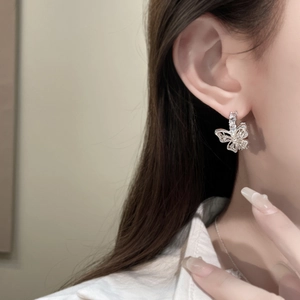 Elegant silver bow butterfly earrings with hollow design, pearls and sparkling crystals