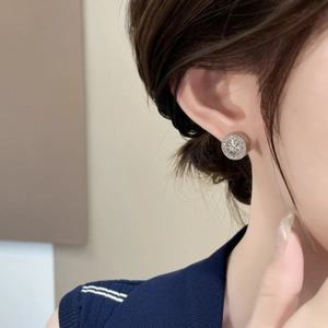 Sparkling silver round starburst stud earrings with micro-paved cubic zirconia for women