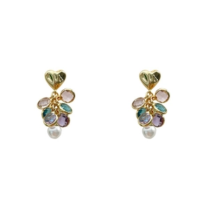 Elegant gold heart earrings with colorful beads and white pearls on white background