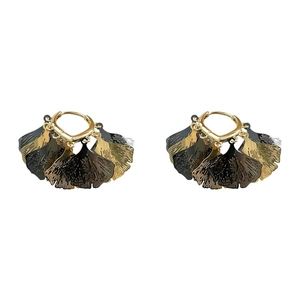 Vintage hollow gingko leaf fringe earrings in matte black and gold finish on white