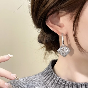 Sparkling diamond-encrusted rhombic geometric drop earrings plated in 18K gold