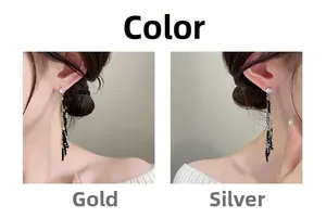 Detailed comparison of long gold and silver tassel earrings with rhinestones on model