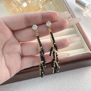 Elegant gold tassel earrings with clear crystals and black beads for women