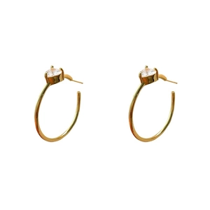 Elegant gold hoop earrings with sparkling heart-shaped zircon studs on white background