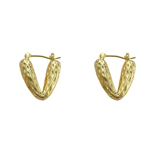Gold plated heart earrings with vintage hammered texture in a minimalist geometric design