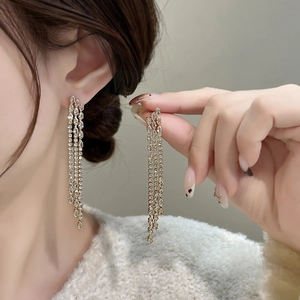Elegant long chain tassel earrings with gold finish and sparkling zircon stones
