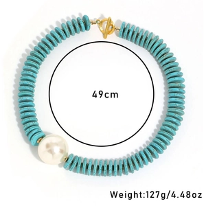 Detail of turquoise bead necklace with white pearl and gold toggle clasp, length 49cm