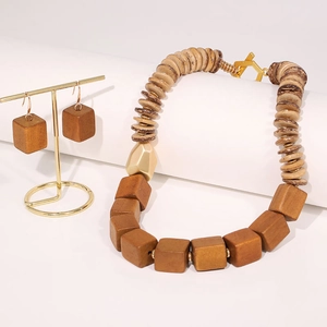 Bohemian handmade beaded wood necklace and earring set with golden metal accents