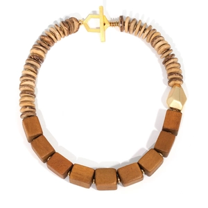 Handmade wooden bead necklace with geometric blocks and gold T-bar clasp on white background