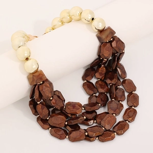 Handmade multilayer bohemian necklace with gold metallic spheres and brown textured beads