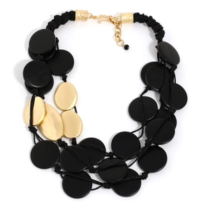 Multilayer long statement necklace featuring black matte discs and gold brushed oval pieces