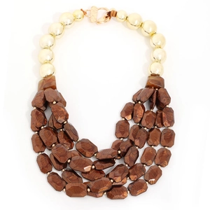 Multilayer bohemian handmade beaded necklace featuring gold beads and brown resin stones