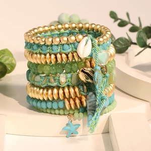Multilayer bohemian beaded bracelet set featuring sea turtle, seashell, and star charms
