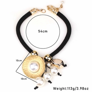 Elegant chunky faux pearl necklace with black braided rope and golden hammered pendant