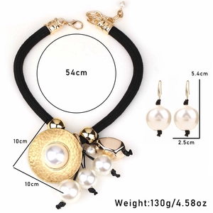 Detailed size view of imitation pearl necklace with gold hammered disc and earrings set