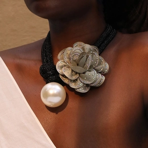 Elegant floral choker with grey fabric flower, rhinestone edges and a white faux pearl