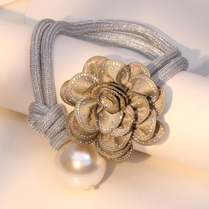 Detailed view of fabric rose necklace with sparkling rhinestones and elegant faux pearl