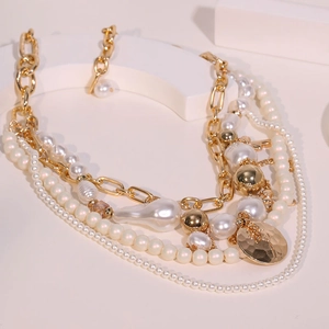 Elegant multi-layer choker necklace with white imitation pearls and golden metal chains