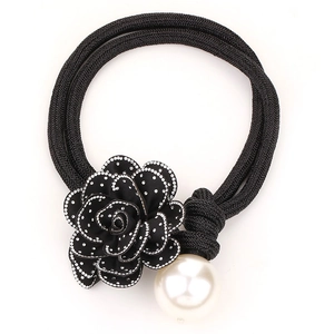 Elegant camellia flower necklace with diamond accents and white faux pearl detail
