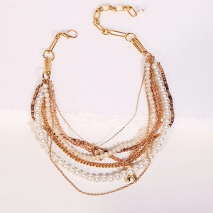 Bohemian multi-layer necklace with faux pearls, beads, and a gold letter A pendant