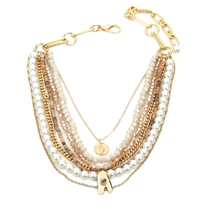 Bohemian multi-layer necklace with faux pearls, crystal beads, and a golden sun pendant