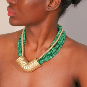 Bohemian multilayer necklace with green beads and hammered gold V-shaped pendant