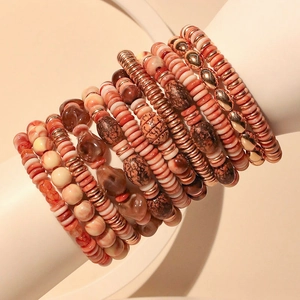 Bohemian multilayer acrylic beaded bracelet set with warm tones on model arm